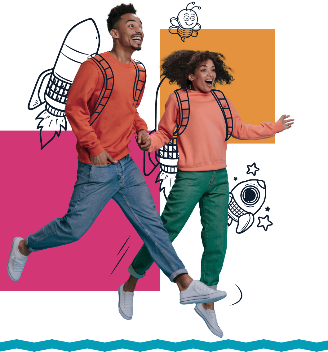 Two students excitedly jumping while wearing colorful sweatshirts and casual jeans